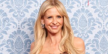 Sarah Michelle Gellar showcases her unique tattoo in thigh-high split dress at star studded premiere